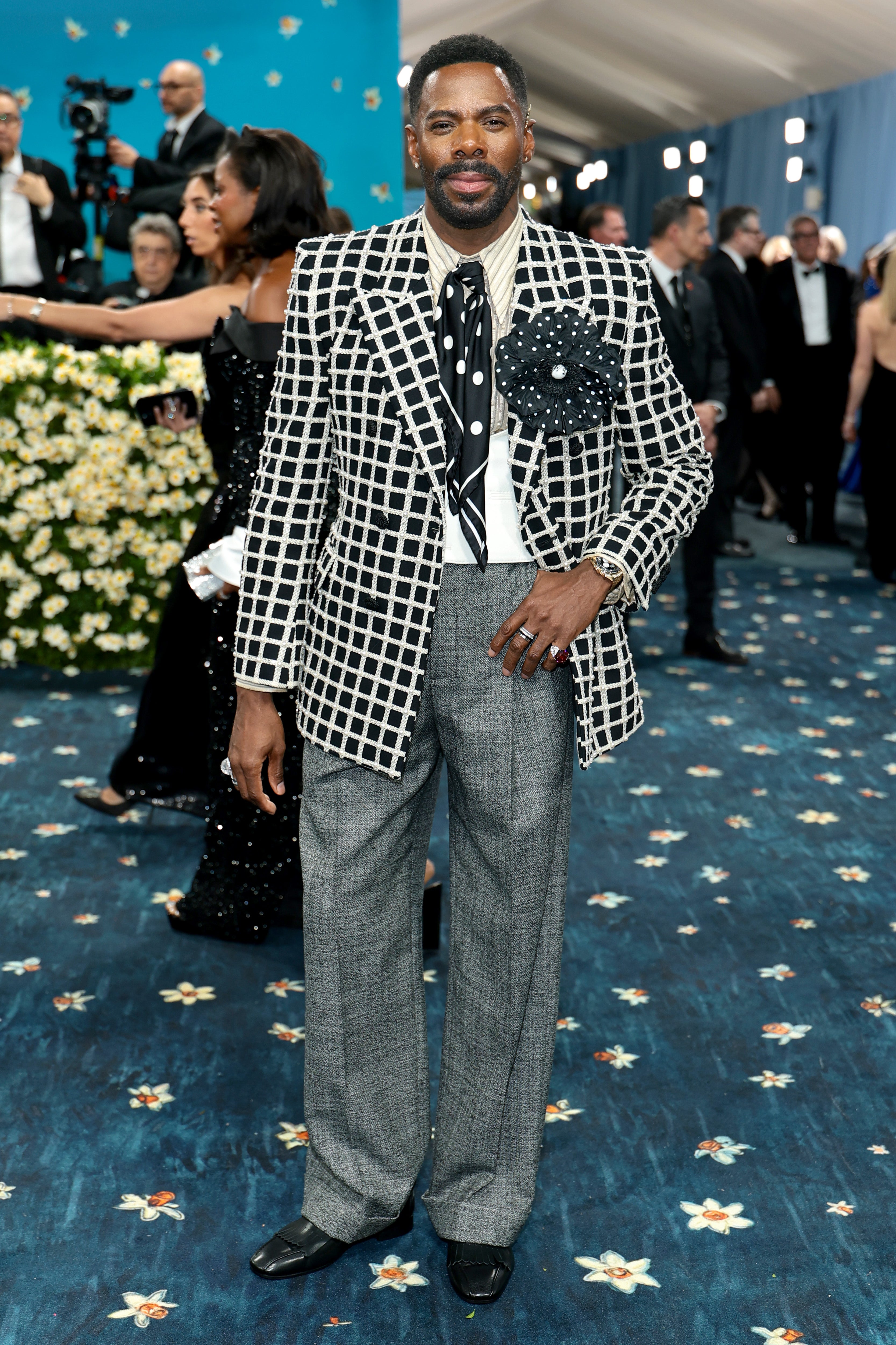 The ‘Four Seasons’ star had an outfit change on the red carpet. His second look was a white and black striped jacket, with a black rose-shaped pin on it