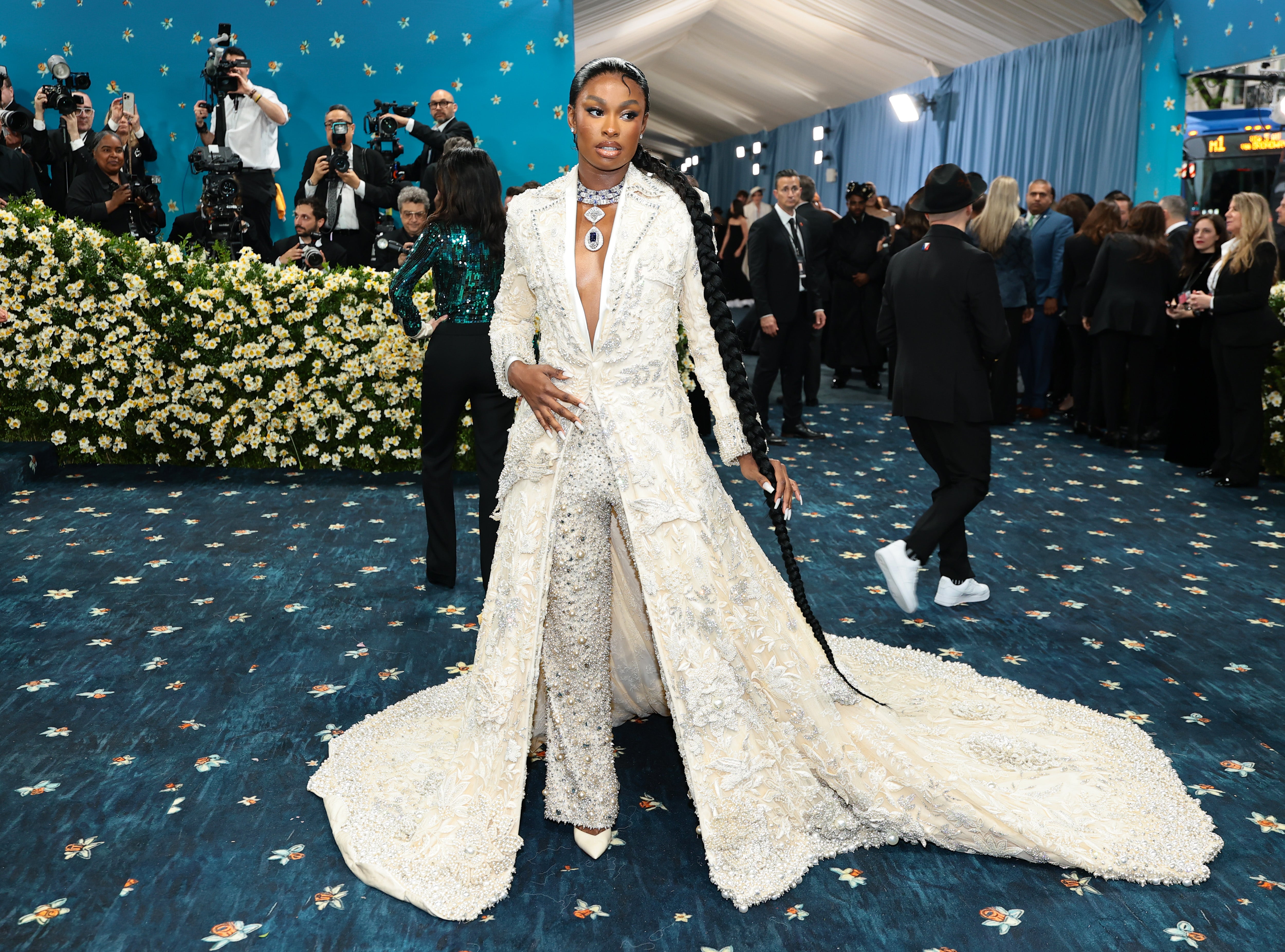 Jones’s jacket featured a floor-length train. She also had her hair in a long braid and her nails painted white