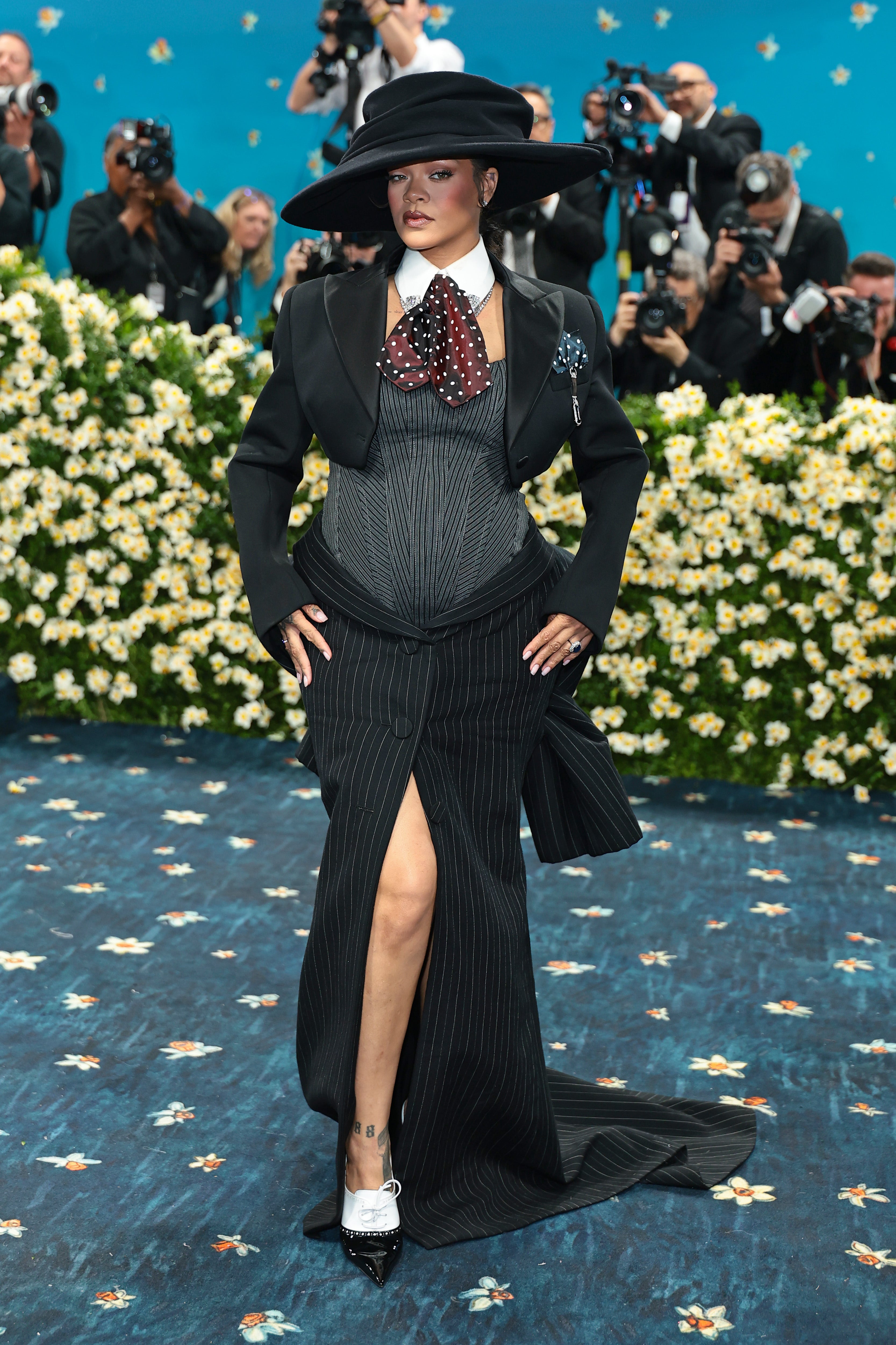 The singer’s skirt featured a slit and train. Rihanna, who confirmed she was pregnant with her third child before the event , showed off her baby bump