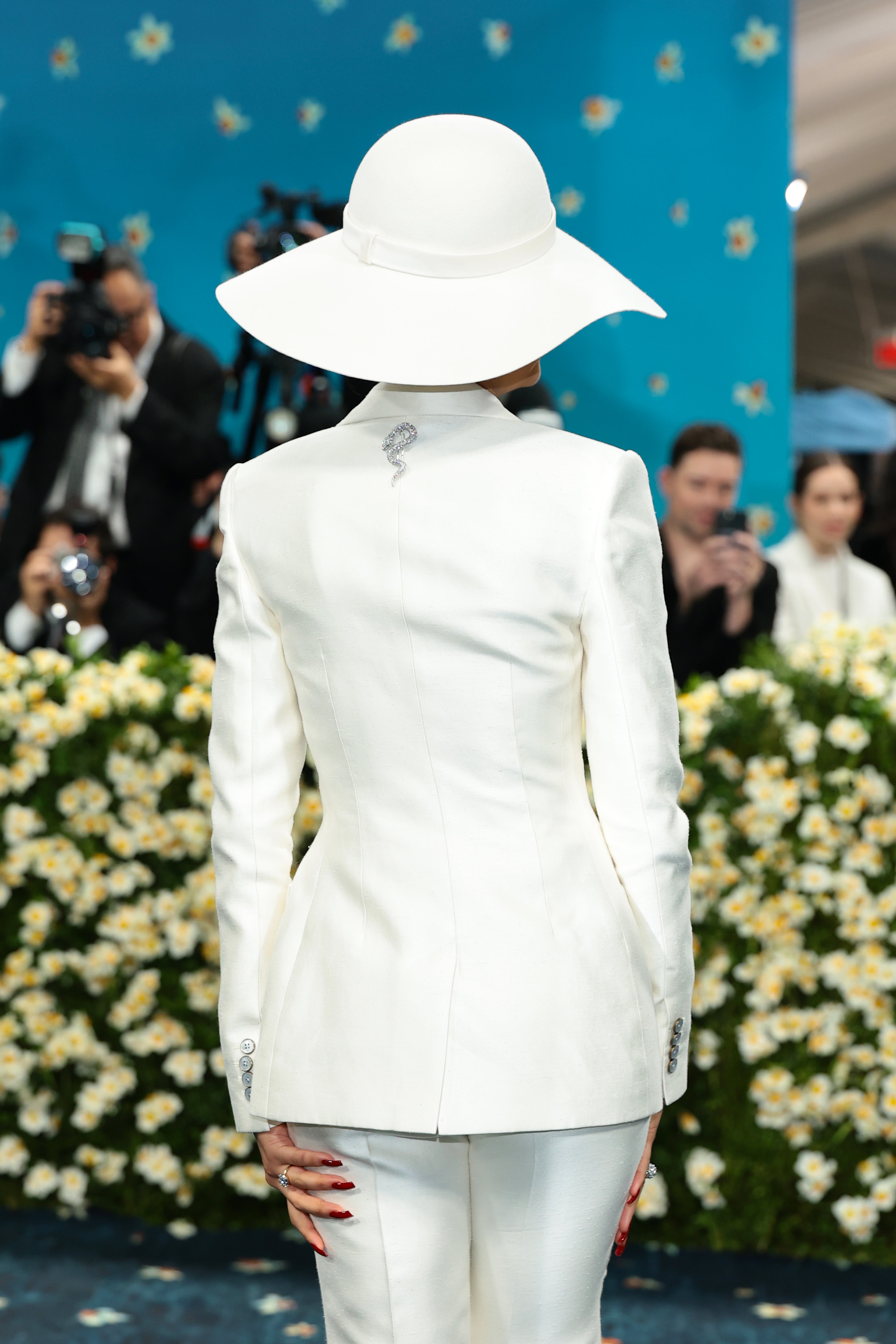 The back of Zendaya’s suit included a stunning accessory — a silver snake brooch